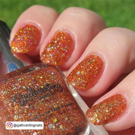 orange almond nails|orange sparkly nails.